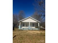 Charming single story home with a covered front porch and blue accents at 1210 Cloninger Ave, Gastonia, NC 28052