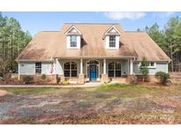 Charming single Gathering home features an inviting front porch with stone accents at 1485 Sierra Ln, York, SC 29745