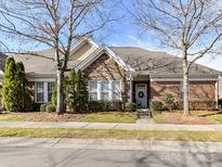 Charming single-story home featuring a blend of stone and brick, complemented by a well-maintained front yard and inviting entrance at 2670 Bellasera Way, Matthews, NC 28105