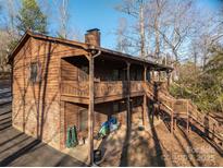 A beautiful, two-story lake house featuring natural wood and multiple covered patios at 8749 Dog Leg Rd # 7, Sherrills Ford, NC 28673