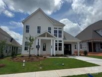 Beautiful two-story home with a well-manicured lawn and inviting front porch at 7441 Fighting Creek Rd # 30, Sherrills Ford, NC 28673