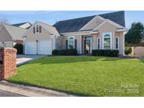 Charming home featuring a lush green lawn, well-maintained landscaping, and an inviting front entrance at 9130 Twilight Hill Ct, Charlotte, NC 28277