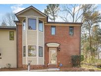 Charming brick townhome with multi-pane windows and a welcoming front entrance at 1035 Nw Wexford Pl # D3, Concord, NC 28027