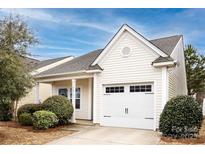 Charming home with a one-car garage, manicured bushes, and a well-maintained lawn, offering great curb appeal at 5216 Crystal Lakes Dr, Rock Hill, SC 29732