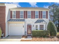 Charming two-story home featuring red shutters, white siding, well-kept landscaping, and an attached one-car garage at 151 Kallie Loop, Mooresville, NC 28117