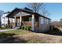 Charming craftsman-style home featuring a welcoming front porch and nicely landscaped yard at 236 Victoria Ave, Charlotte, NC 28202