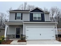 Charming two-story home with a two car garage and stone accents at 3422 Saddlebred Dr, Gastonia, NC 28052