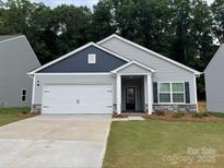 Charming single-Gathering home with a well-maintained lawn and a two-car garage, creating an inviting curb appeal at 3606 Clover Valley Dr, Gastonia, NC 28052