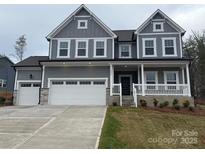 Charming two-story home featuring a classic design and well-manicured landscaping at 12027 Mariners Cove Ct # 381, Lancaster, SC 29720