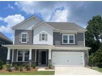 Charming two-story home featuring gray siding, stone accents, and a welcoming front porch at 177 Glenn Dr, Mooresville, NC 28115