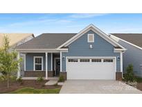 Charming single-Gathering home boasting blue siding, brick accents, and a two-car garage at 25966 Appleyard Ct # 1205, Lancaster, SC 29720