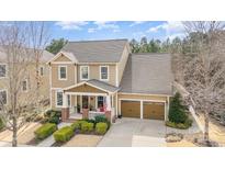 Charming two-story home featuring a welcoming front porch, manicured lawn, and a two-car garage at 3439 Richards Xing, Fort Mill, SC 29708