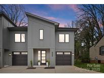Modern two-story home features a contemporary design, dual garages, and stylish facade at 503 Norris Ave, Charlotte, NC 28206