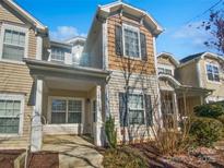 Charming townhouse featuring a covered front porch and craftsman-style details at 10462 Trolley Run Dr, Cornelius, NC 28031
