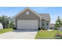 Charming one-story home with a two-car garage and well-manicured lawn at 200 J.P. Dr # 184P, Albemarle, NC 28001