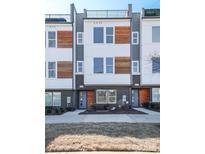 Modern townhome showcasing stylish facade, brick accents, and private rooftop terrace at 2123 Isom St, Charlotte, NC 28208