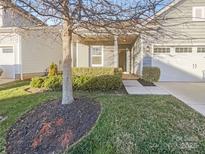 Charming home with a well-manicured lawn and covered front entrance, including an attached garage at 23186 Goose Down Ln, Lancaster, SC 29720
