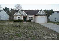 Charming single-story home features a manicured front yard and attached one car garage at 4718 Sahalee Ln, Charlotte, NC 28216