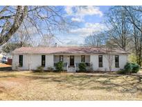 Charming single-story home with a landscaped front yard and inviting entrance at 702 Shearers Rd, Mooresville, NC 28115