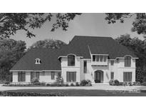 Stately two-story home with a symmetrical facade, arched entryway, and manicured landscaping at 1021 Maxwell Ct # 6, Marvin, NC 28173