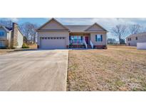 Charming single-Gathering home with a two-car garage and well-maintained front lawn at 1529 Alex Dr, Shelby, NC 28152