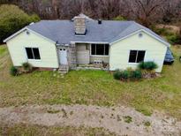 A quaint house featuring a well-manicured front lawn and charming curb appeal at 2126 W C St, Kannapolis, NC 28081