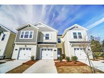 Charming townhomes feature a modern design with individual garages and well-manicured landscaping at 296 Laura Elizabeth Ln, Clover, SC 29710