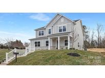 Charming two-story home with a well-manicured lawn and inviting entrance at 3924 13Th Ne St, Hickory, NC 28601