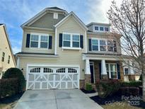 Charming two-story home with a two-car garage and well-maintained landscaping at 1019 Dunhill Ln, Waxhaw, NC 28173