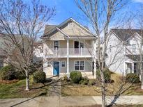 Charming two-story home with a welcoming front porch and neat landscaping at 19531 Deer Valley Dr, Cornelius, NC 28031
