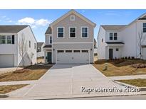 Charming two-story home with gray siding, a two-car garage, and well-maintained landscaping at 2302 E Main St # 1P, Albemarle, NC 28001