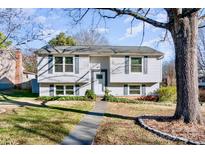 Charming two-story home featuring a well-maintained lawn and a walkway leading to the front door at 5304 Split Oak Dr, Charlotte, NC 28227
