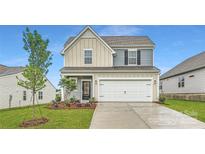 Charming two-story home with a well-manicured lawn and attached two-car garage at 8421 Norman Forest Rd, Lancaster, SC 29720