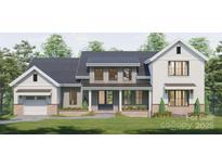 Charming two-story home with grey siding, crisp white trim and inviting covered front porch at 000A Duck Cove Rd, Belmont, NC 28012