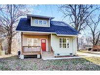 Charming home featuring a covered porch and a bright red front door at 508 N Hill St, Dallas, NC 28034