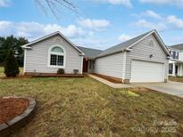 Charming single-Gathering home with a well-manicured lawn and attached two car garage at 4627 Avalon Forest Ln, Charlotte, NC 28269