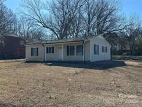 Charming single-story home featuring a well-kept front yard with traditional design elements at 502 E Maine Ave, Bessemer City, NC 28016