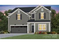 Charming two-story home featuring gray siding, black shutters, an attached garage, and a manicured front lawn at 13744 Roderick Dr # 173, Huntersville, NC 28078
