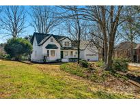 Charming two-story home with a landscaped front yard and attached two-car garage at 1517 Rice Hope Ct, Gastonia, NC 28056