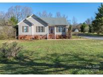 Charming single-Gathering home with a well-manicured front yard, inviting curb appeal, and a classic design at 2520 Foxworth Dr, Monroe, NC 28110
