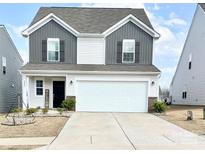 Charming two-story home with a welcoming front porch, two-car garage, and a well-maintained lawn at 2847 Legacy Ridge Ln, Catawba, NC 28609