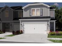 Modern townhome featuring a two-car garage and neutral color palette at 5021 Kellaher Pl, Charlotte, NC 28216