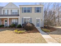 Charming two-story home with tidy landscaping and a welcoming entrance at 6879 Rothchild Dr, Charlotte, NC 28270