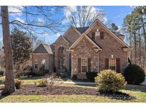 Well-maintained brick and stone home featuring neat landscaping and shutters for enhanced curb appeal at 170 Anniston Way, Davidson, NC 28036