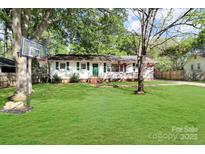 Charming single-story home with a well-maintained lawn and a basketball hoop in the front yard at 908 Dogwood Dr, Gastonia, NC 28054