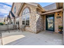 Inviting front porch with stone accents, seating area, and charming entrance at 808 Wynnshire Dr # A, Hickory, NC 28601