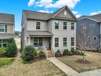 Charming two-story home with inviting front porch and well-manicured lawn at 117 Stowe Rd, Belmont, NC 28012