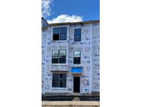 Exterior view of new construction home featuring large windows and a modern design at 15332 Ballancroft Pkwy # 17, Charlotte, NC 28277