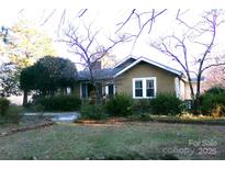 Charming single-story home with a neutral exterior, complemented by tidy landscaping and mature trees at 33320-B Hobe Rd, Albemarle, NC 28001