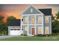 Two-story gray home with a welcoming front porch, second story balcony, and attached two-car garage at 1055 Kinship Dr # 78, Lancaster, SC 29720